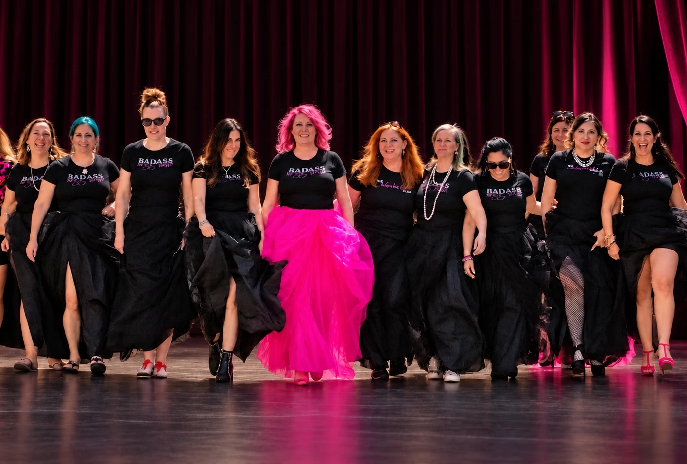 Jamie Gates and the women of Badass Boss Babe Club walking the stage together in Badass Boss Babe t-shirts